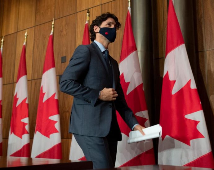 Prime Minister Justin Trudeau leaves a news conference in Ottawa on Wednesday, March 3, 2021. THE CANADIAN PRESS/Adrian Wyld.