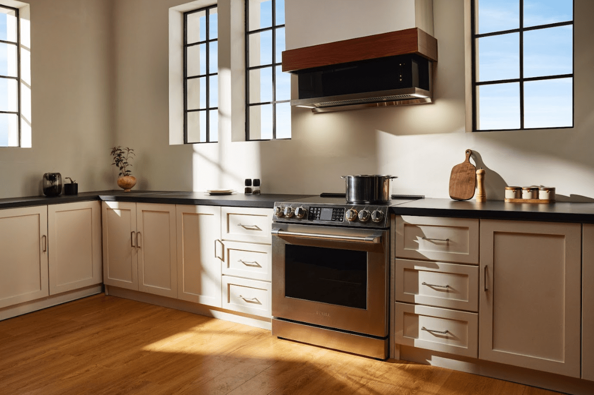 A kitchen with white cabinets and a stove AI-generated content may be incorrect.