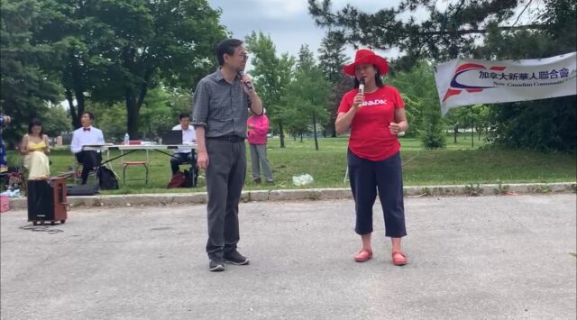 A person and person standing in a parking lot Description automatically generated with low confidence