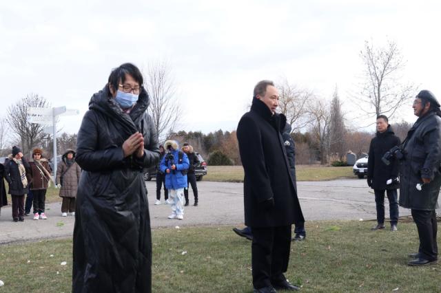 A person and person wearing face masks Description automatically generated