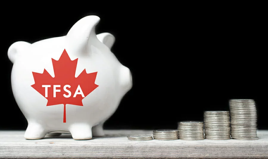 A piggy bank with a red maple leaf on it Description automatically generated