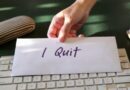 This stock image shows a hand holding a letter of resignation. (Credit: Shutterstock)