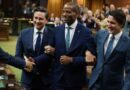 Leader of the Opposition Pierre Poilievre and Prime Minister Justin Trudeau drag new House Speaker Greg Fergus to the Speaker's chair in the House of Commons on October 3.