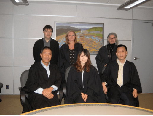 A group of people posing for a photo AI-generated content may be incorrect.