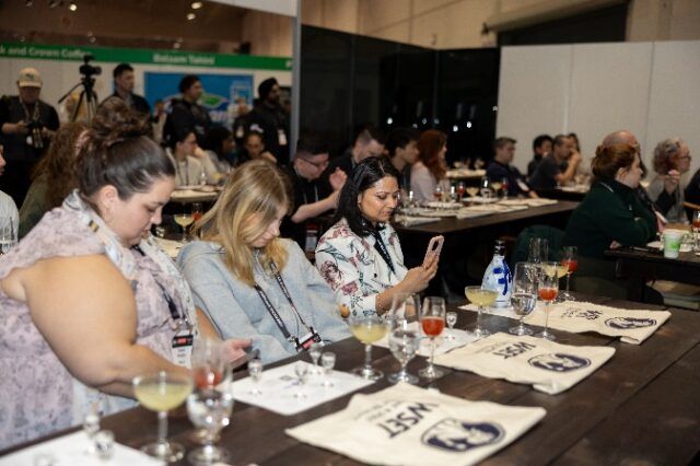 A group of people sitting at a table AI-generated content may be incorrect.