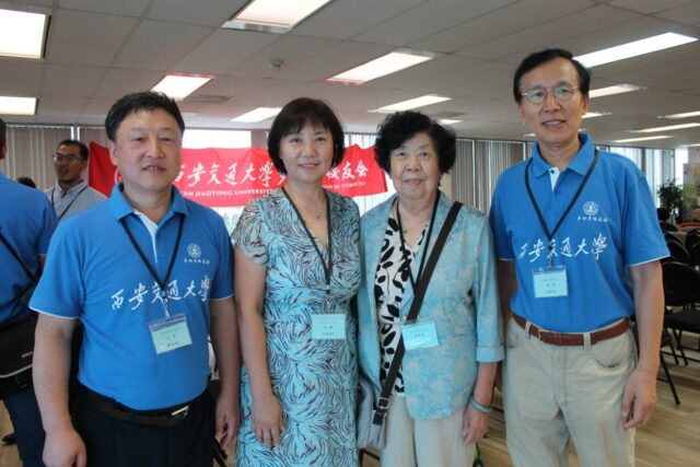 A group of people posing for a photo

AI-generated content may be incorrect.