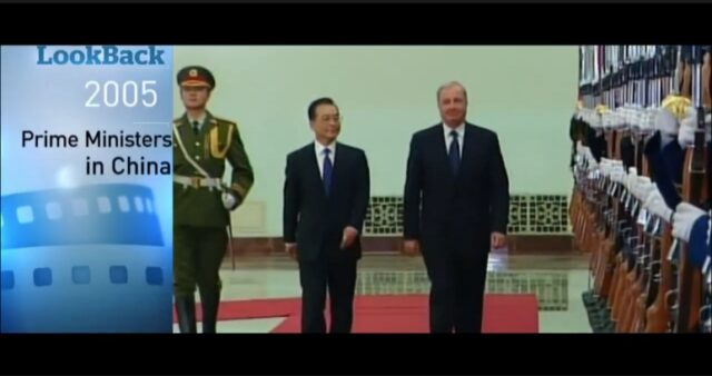 A group of men in suits walking AI-generated content may be incorrect.