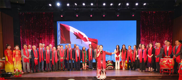 A group of people on a stage AI-generated content may be incorrect.