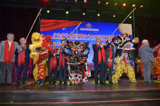 A group of people on a stage AI-generated content may be incorrect.