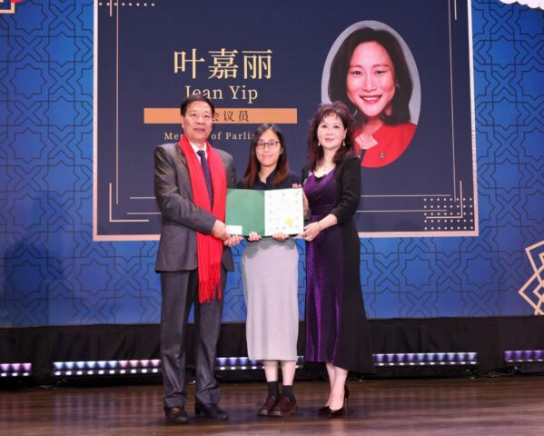 A group of people on a stage AI-generated content may be incorrect.