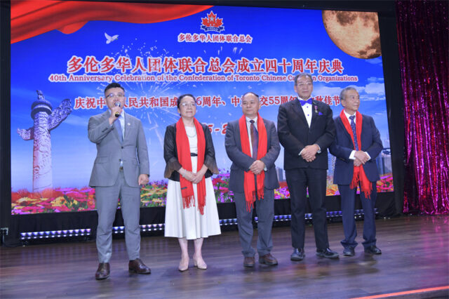 A group of people on a stage AI-generated content may be incorrect.