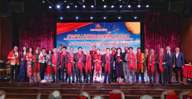 A group of people on a stage AI-generated content may be incorrect.