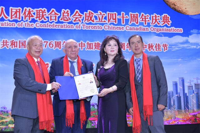 A group of people posing for a photo AI-generated content may be incorrect.