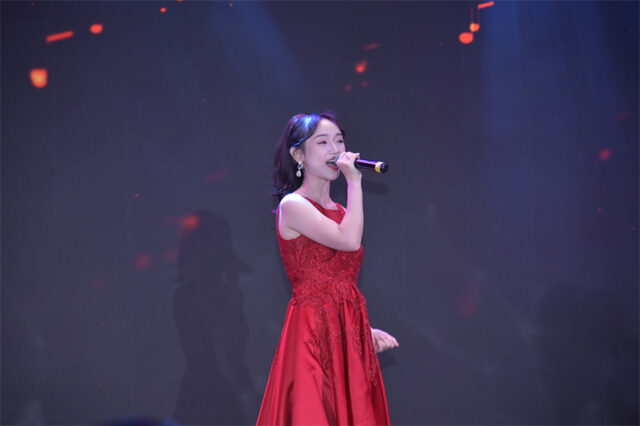 A person singing into a microphone AI-generated content may be incorrect.